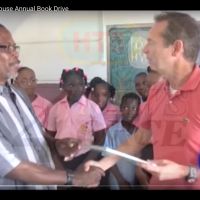 Local TV covered the event. Pius Bastien–Desruisseaux School principal–offers Richard the 